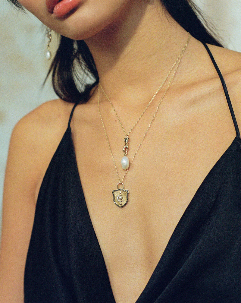Harris Reed Solid Gold Shield Necklace | detail view